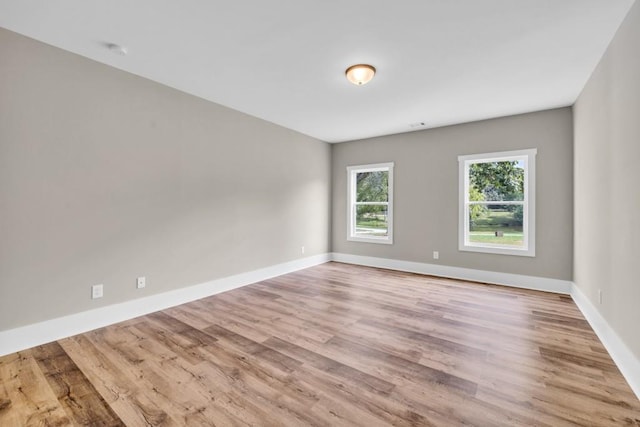 spare room featuring light hardwood / wood-style flooring