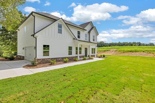 exterior space featuring a garage and a lawn