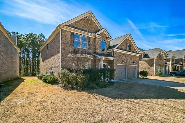 view of front of property featuring brick siding, driveway, an attached garage, and central AC unit