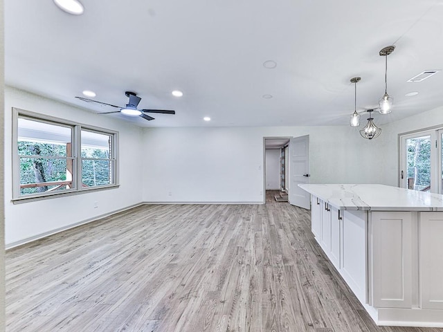 221 Wonewok Dr, Canton, GA 30114 - unfurnished living room with light wood finished floors, recessed lighting, and ceiling fan