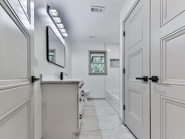 221 Wonewok Dr, Canton, GA 30114 - full bathroom with marble look tiles, vanity, and tub / shower combination