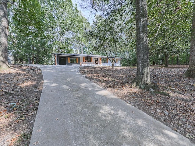 221 Wonewok Dr, Canton, GA 30114 - view of front of property with driveway, a porch, and a carport