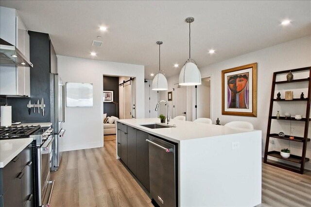 interior space featuring a barn door and light hardwood / wood-style flooring