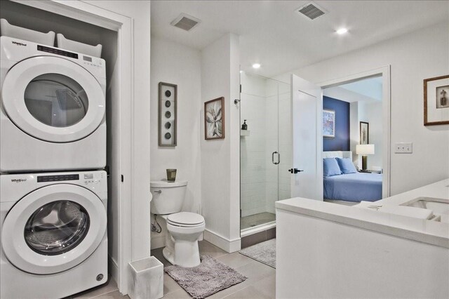 kitchen featuring wall chimney exhaust hood, sink, hanging light fixtures, a center island with sink, and premium appliances