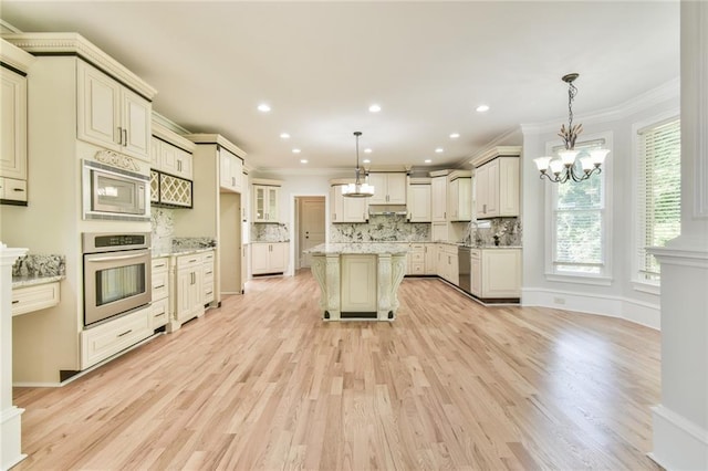 5121 Hope Ct SW, Lilburn, GA 30047 - kitchen featuring stainless steel appliances, ornamental molding, backsplash, light wood finished floors, and a chandelier