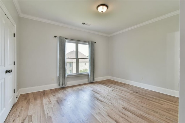 5121 Hope Ct SW, Lilburn, GA 30047 - empty room featuring light wood-style flooring, crown molding, and baseboards