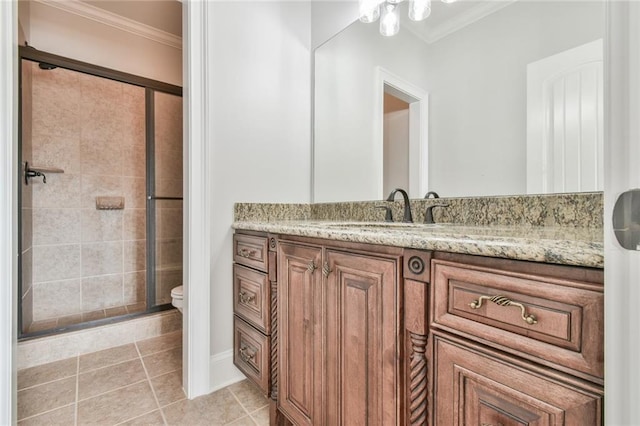 5121 Hope Ct SW, Lilburn, GA 30047 - bathroom with ornamental molding, vanity, a stall shower, toilet, and tile patterned flooring