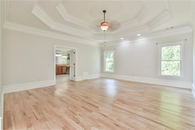 5121 Hope Ct SW, Lilburn, GA 30047 - unfurnished room with a raised ceiling, ornamental molding, a ceiling fan, light wood finished floors, and baseboards