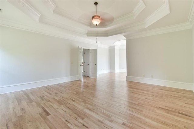 5121 Hope Ct SW, Lilburn, GA 30047 - empty room with crown molding, a raised ceiling, light wood-style floors, ceiling fan, and baseboards