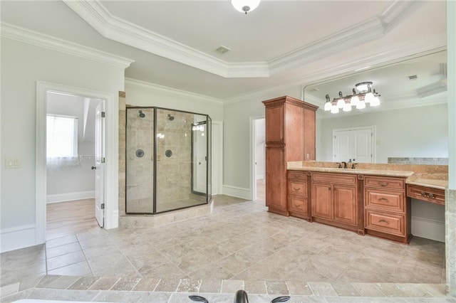 5121 Hope Ct SW, Lilburn, GA 30047 - bathroom featuring vanity, a shower stall, crown molding, baseboards, and a raised ceiling