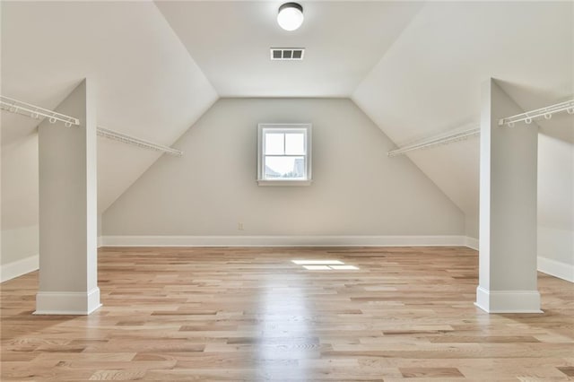5121 Hope Ct SW, Lilburn, GA 30047 - additional living space featuring wood finished floors, lofted ceiling, and baseboards