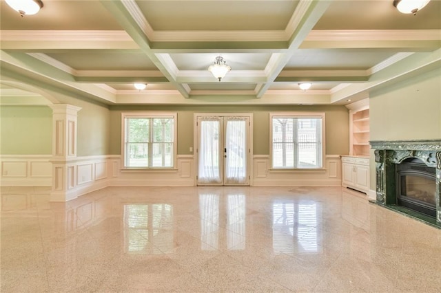 5121 Hope Ct SW, Lilburn, GA 30047 - unfurnished living room featuring a decorative wall, granite floors, plenty of natural light, french doors, and beamed ceiling