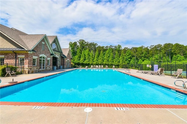 5121 Hope Ct SW, Lilburn, GA 30047 - community pool featuring a patio area