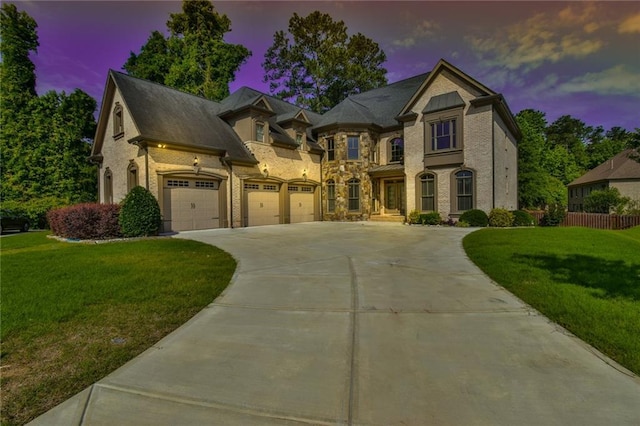 5121 Hope Ct SW, Lilburn, GA 30047 - french country home featuring driveway and brick siding