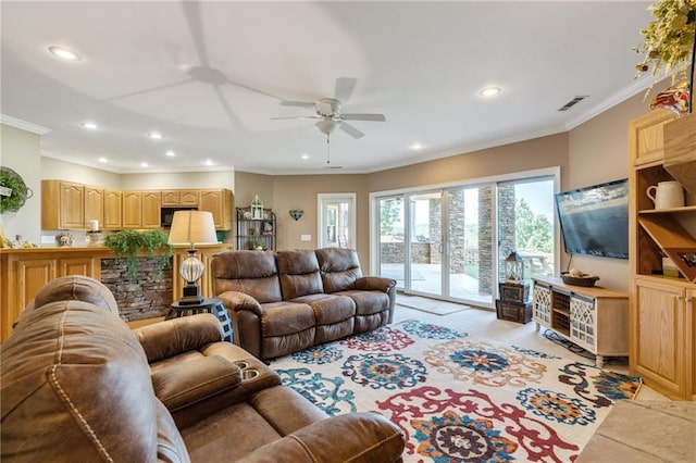 living room featuring ceiling fan and ornamental molding