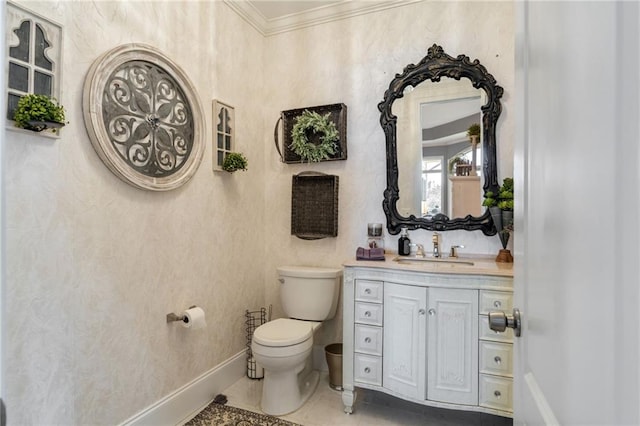 bathroom with tile patterned flooring, crown molding, toilet, and vanity