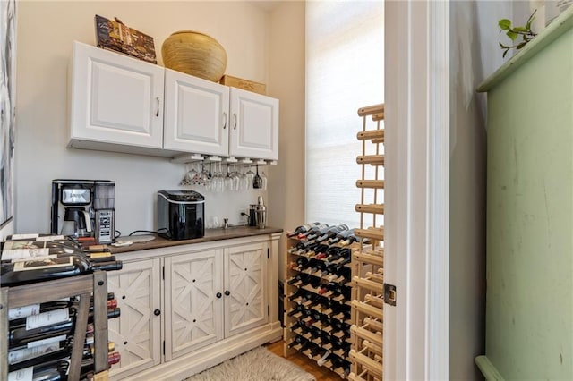 wine area with light hardwood / wood-style floors