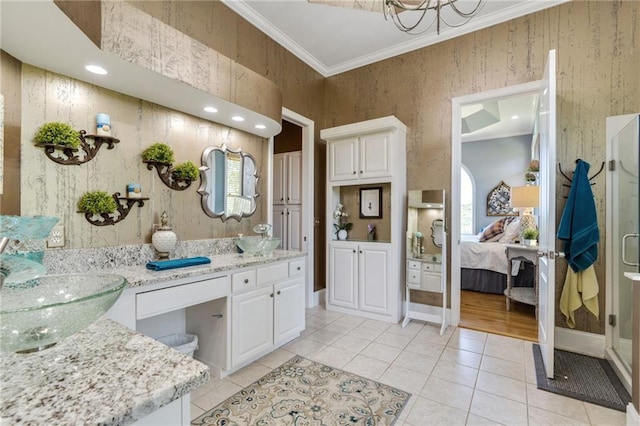 bathroom with a wealth of natural light, dual bowl vanity, hardwood / wood-style flooring, and ornamental molding