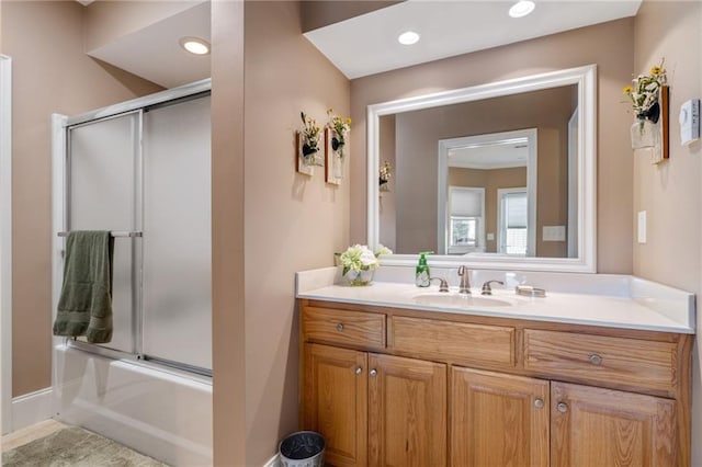 bathroom with vanity, combined bath / shower with glass door, and tile patterned flooring