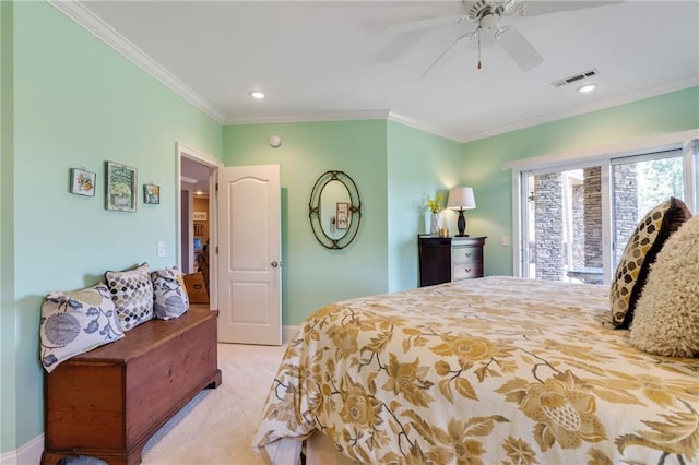 carpeted bedroom with ornamental molding and ceiling fan