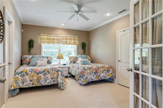 carpeted bedroom featuring ornamental molding, ceiling fan, and french doors