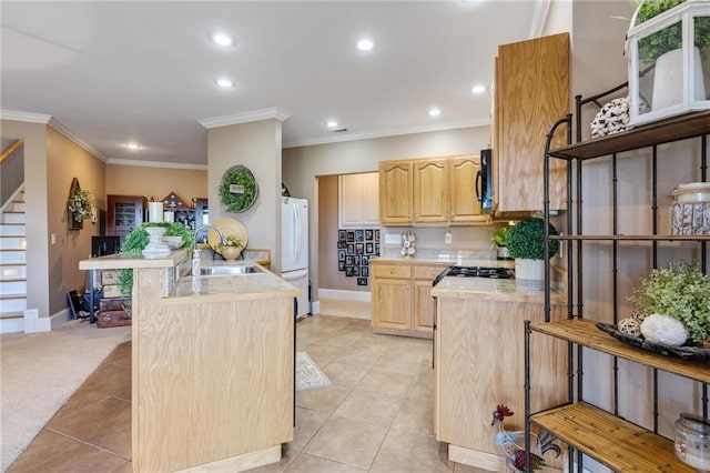 kitchen with light brown cabinetry, sink, light tile patterned flooring, a center island, and white fridge