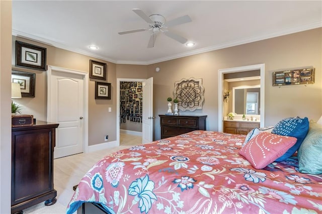 bedroom featuring a closet, ensuite bath, light colored carpet, ceiling fan, and ornamental molding