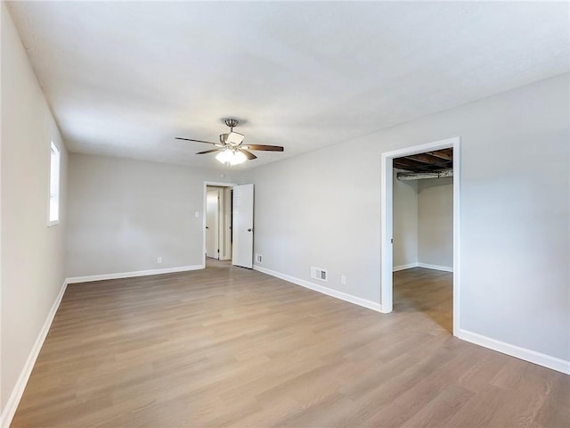 unfurnished room featuring ceiling fan and light hardwood / wood-style flooring