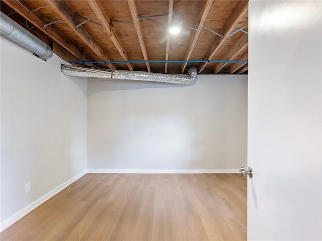 basement featuring light wood-type flooring