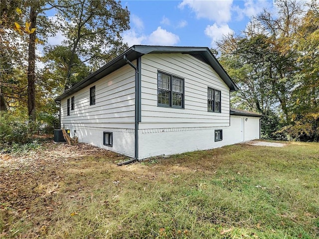 view of property exterior featuring a lawn and central air condition unit