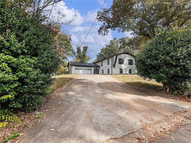 view of front facade with an outbuilding and a garage