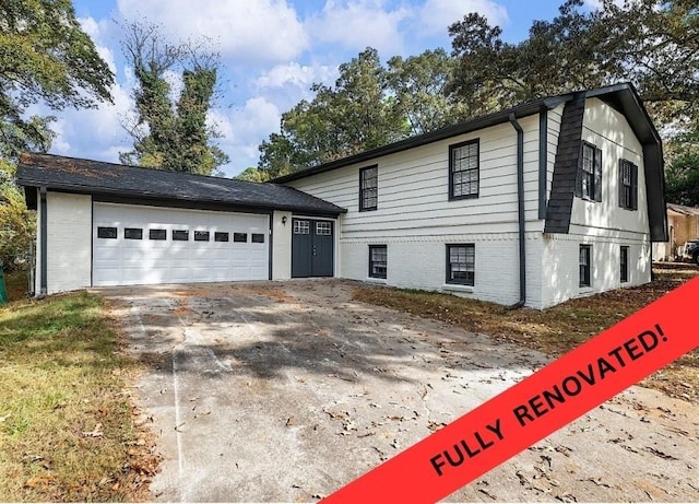 view of front of property with a garage