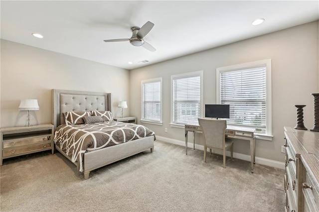 bedroom featuring recessed lighting, light carpet, and baseboards