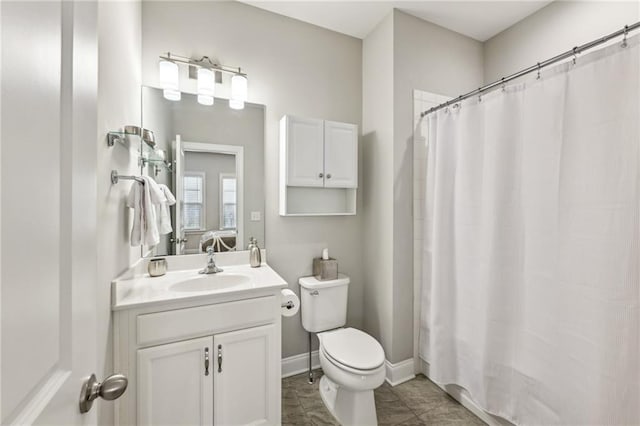 full bath with curtained shower, toilet, ensuite bathroom, vanity, and baseboards