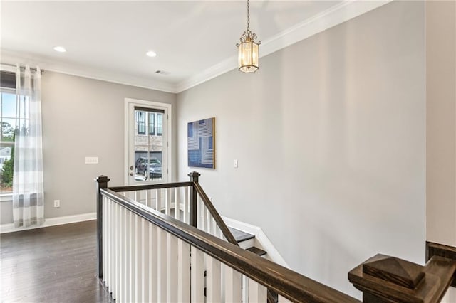 corridor featuring crown molding, plenty of natural light, an upstairs landing, and baseboards