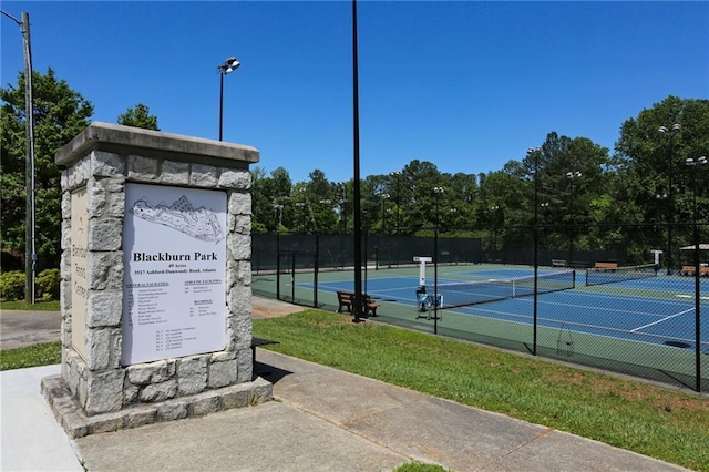 view of sport court with fence