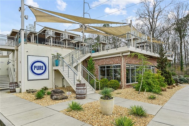 view of building exterior featuring stairs