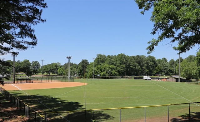 view of tennis court featuring fence