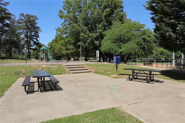 view of community with playground community and a lawn