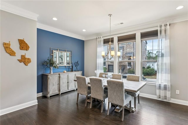 dining space featuring a chandelier, a wealth of natural light, and ornamental molding