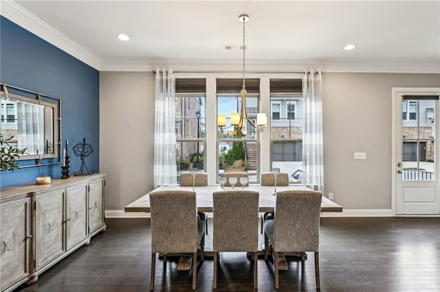 dining space with ornamental molding, a wealth of natural light, and dark wood-type flooring