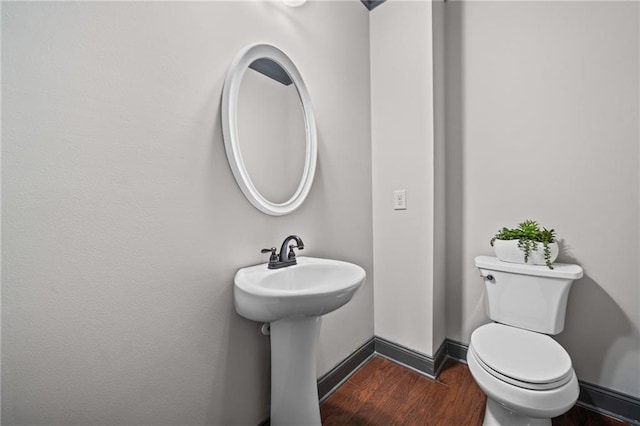 775 Duberry St, Alpharetta, GA 30004 - bathroom with wood finished floors, toilet, baseboards, and a sink