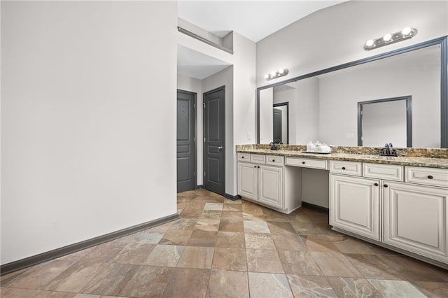 775 Duberry St, Alpharetta, GA 30004 - full bath featuring stone tile flooring, baseboards, and double vanity