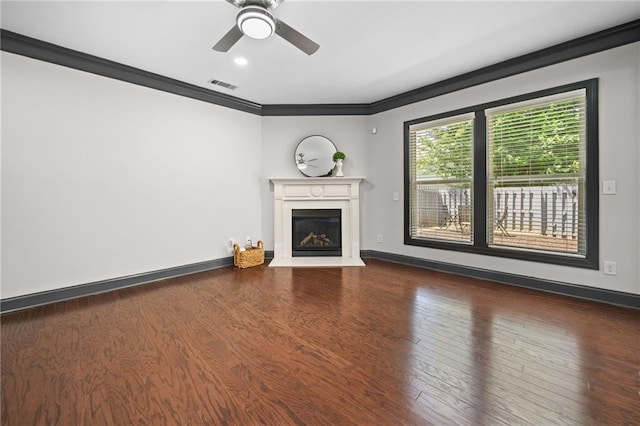 775 Duberry St, Alpharetta, GA 30004 - unfurnished living room featuring crown molding, a fireplace with flush hearth, wood finished floors, ceiling fan, and baseboards