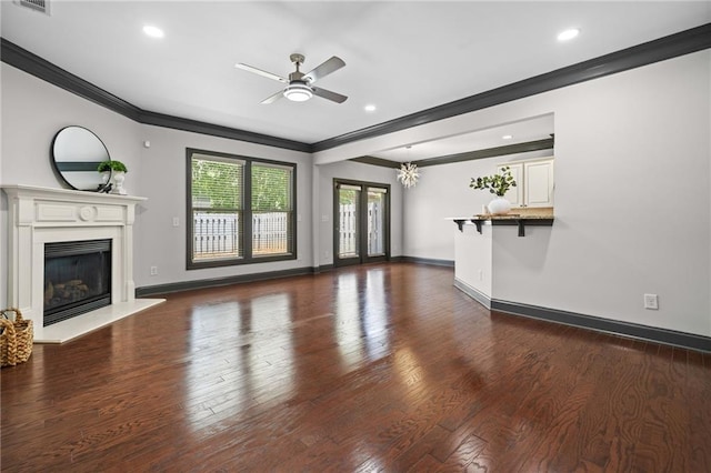 775 Duberry St, Alpharetta, GA 30004 - unfurnished living room with crown molding, ceiling fan, wood finished floors, a glass covered fireplace, and baseboards