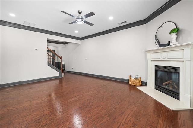 775 Duberry St, Alpharetta, GA 30004 - unfurnished living room with ornamental molding, ceiling fan, a glass covered fireplace, wood finished floors, and stairs