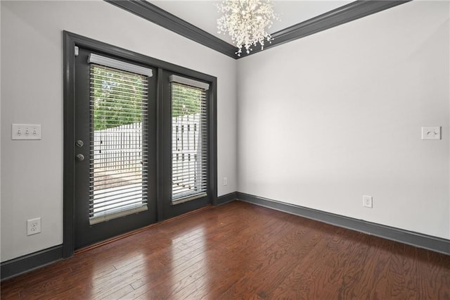 775 Duberry St, Alpharetta, GA 30004 - unfurnished room with a chandelier, crown molding, wood finished floors, and baseboards