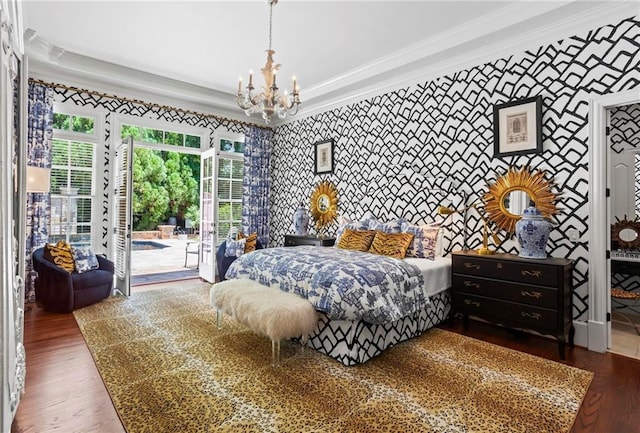 bedroom with ornamental molding, a chandelier, access to outside, and dark hardwood / wood-style flooring