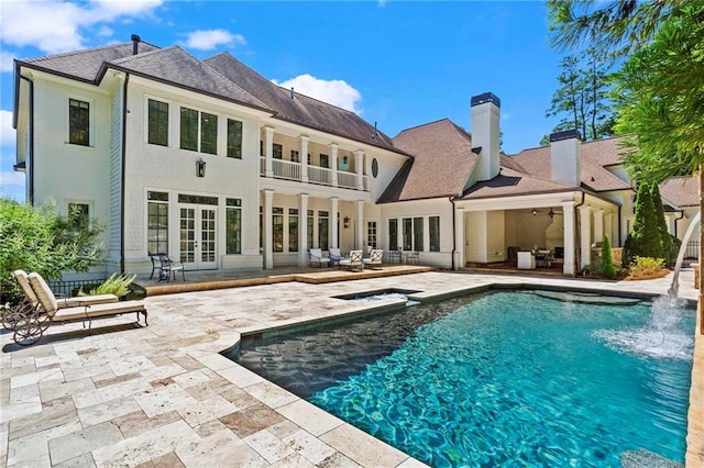 rear view of house featuring an outdoor living space, a patio, ceiling fan, and french doors