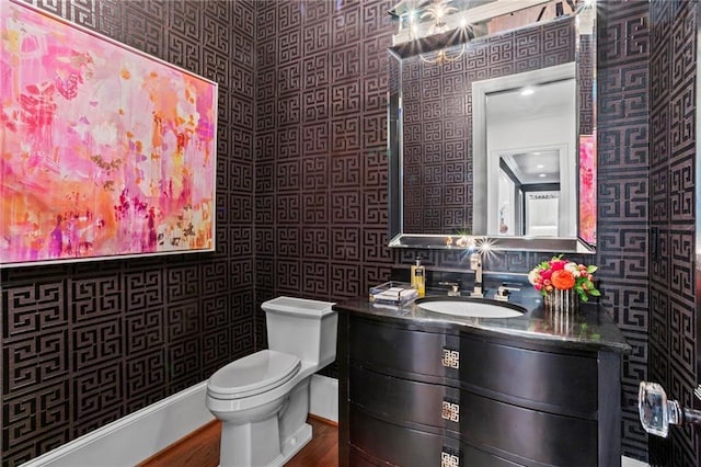 bathroom featuring vanity and toilet